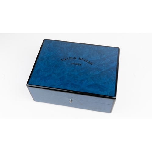 19 - A FRANCK MULLER, GENEVE WATCH BOX.  Of square form, crafted in blue lacquer box, featuring a wooden ... 