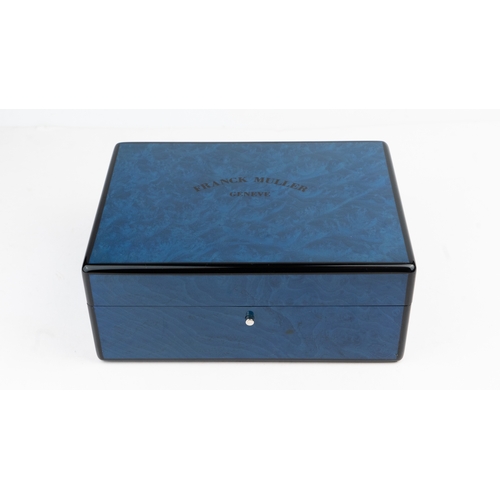 19 - A FRANCK MULLER, GENEVE WATCH BOX.  Of square form, crafted in blue lacquer box, featuring a wooden ... 