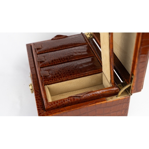 21 - A CROCODILE LEATHER JEWELLERY BOX.        Of rectangular form, exterior crocodile leather, velvet-li... 