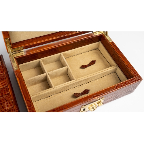 21 - A CROCODILE LEATHER JEWELLERY BOX.        Of rectangular form, exterior crocodile leather, velvet-li... 