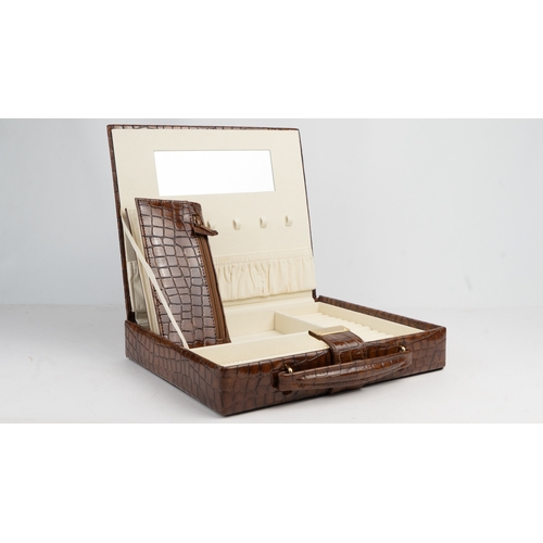 23 - A VINTAGE CROCODILE LEATHER JEWELLERY BOX Of squarel form, the jewllery box crafted from rich brown ... 