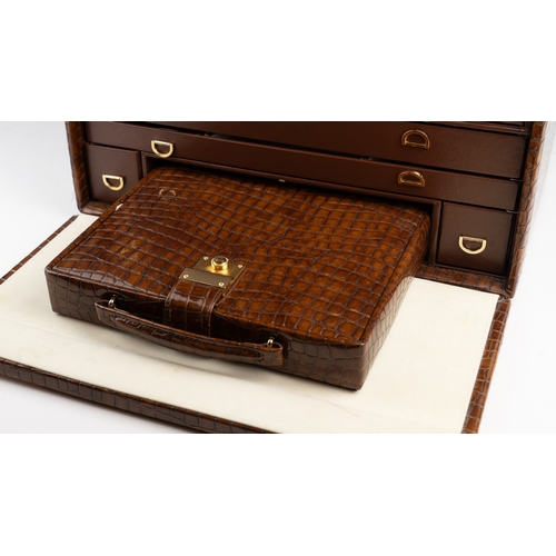 23 - A VINTAGE CROCODILE LEATHER JEWELLERY BOX Of squarel form, the jewllery box crafted from rich brown ... 