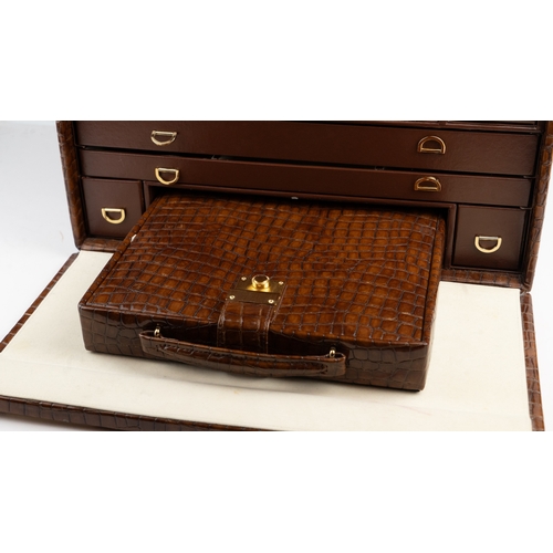 23 - A VINTAGE CROCODILE LEATHER JEWELLERY BOX Of squarel form, the jewllery box crafted from rich brown ... 