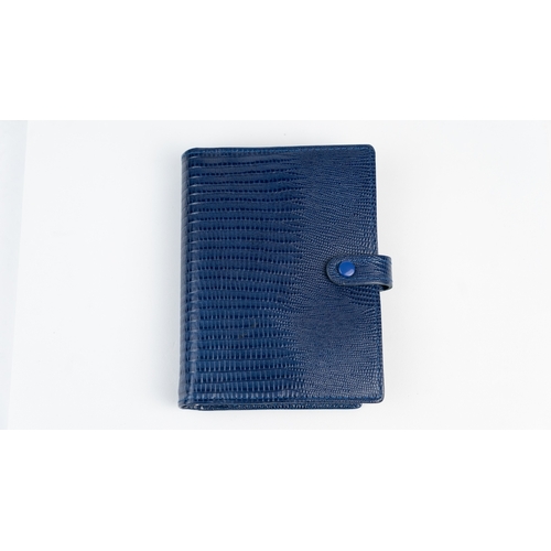 29 - FILOFAX POCKET ORGANISER, MADE IN ENGLAND, Dated 1995
Blue calf leather print wallet with four credi... 