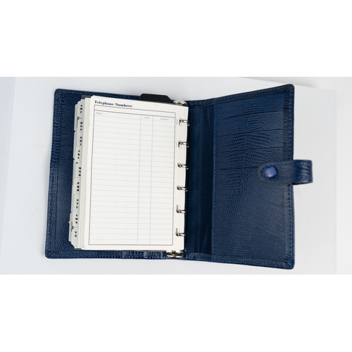 29 - FILOFAX POCKET ORGANISER, MADE IN ENGLAND, Dated 1995
Blue calf leather print wallet with four credi... 