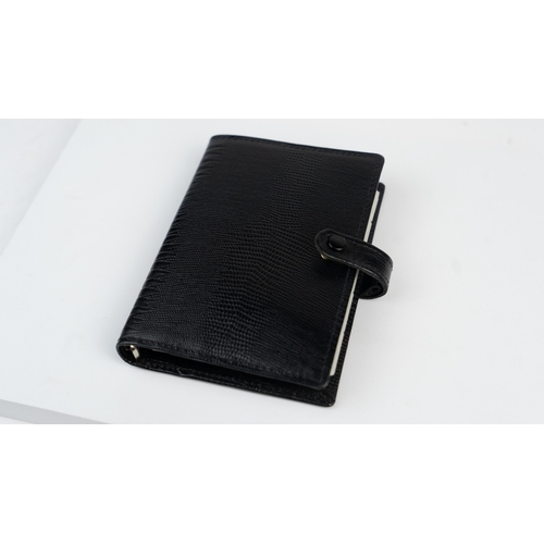 30 - FILOFAX POCKET ORGANISER, MADE IN ENGLAND, dated 1995
Black calf leather print wallet with four cred... 