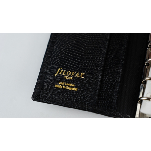 30 - FILOFAX POCKET ORGANISER, MADE IN ENGLAND, dated 1995
Black calf leather print wallet with four cred... 