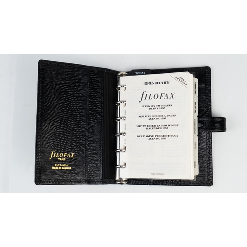 30 - FILOFAX POCKET ORGANISER, MADE IN ENGLAND, dated 1995
Black calf leather print wallet with four cred... 