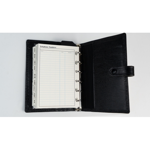 30 - FILOFAX POCKET ORGANISER, MADE IN ENGLAND, dated 1995
Black calf leather print wallet with four cred... 