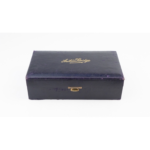 45 - A LEATHER BOX FOR AUCTION BRIDGE, BY THOMAS DE LA RUE & CO LTD, 1924
Of rectangular form, the maroon... 