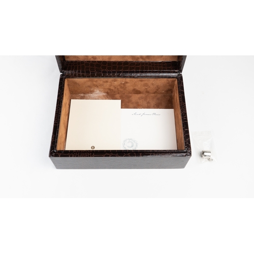 52 - A LEATHER HUMIDOR

Of rectangular form, interior velvety lining, opening to reveal hygrometer and th... 