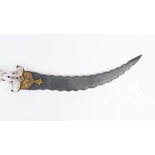 70 - INDIAN JAMBIYA DAGGER, INDIA 

A double-edged, curved dagger in serrated steel, Rock crystal pommel ... 