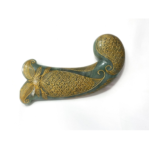 79 - A MUGHAL GREEN JADE HILT, INDIA, 18TH CENTURY 

18th century pistol grip form dagger (Khanjar) hilt ... 