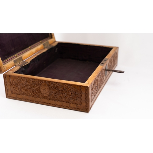 103 - A PERSIAN QAJAR CARVED FRUITWOOD BOX, LATE 19TH CENTURY 
Of rectangular form, resting on flat base, ... 