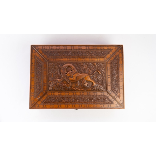 103 - A PERSIAN QAJAR CARVED FRUITWOOD BOX, LATE 19TH CENTURY 
Of rectangular form, resting on flat base, ... 