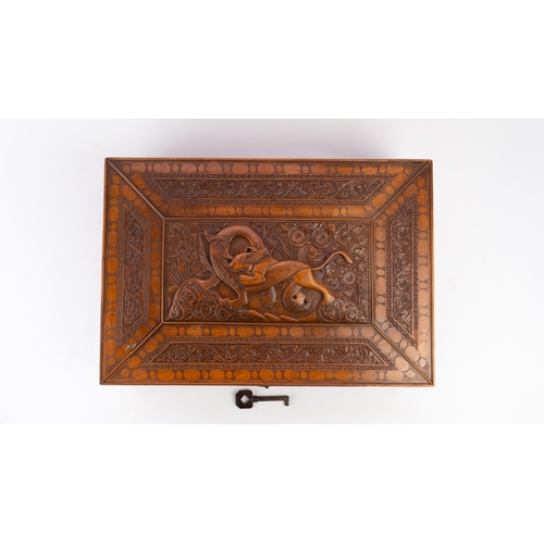 103 - A PERSIAN QAJAR CARVED FRUITWOOD BOX, LATE 19TH CENTURY 
Of rectangular form, resting on flat base, ... 