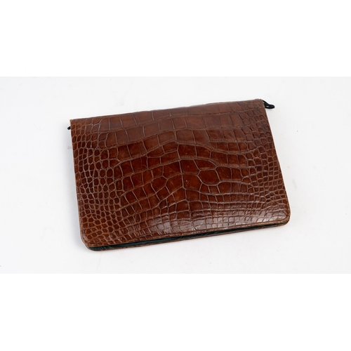 107 - A Crocodile Leather Stationary Case, Europe, 20th Century

Of rectangular form, interior with black ... 