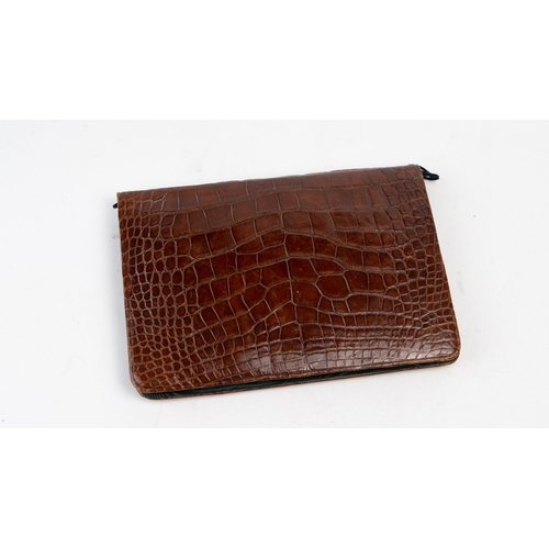 107 - A Crocodile Leather Stationary Case, Europe, 20th Century

Of rectangular form, interior with black ... 