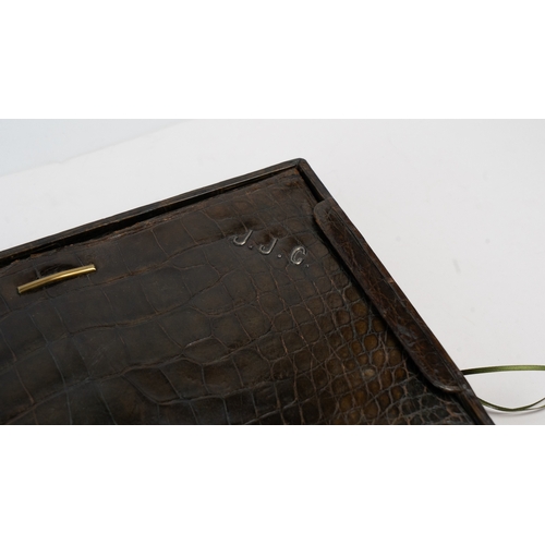 107 - A Crocodile Leather Stationary Case, Europe, 20th Century

Of rectangular form, interior with black ... 