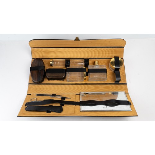 38 - A PORTABLE GENTLEMAN’S GROOMING SET OR VANITY CASE, EARLY 20TH CENTURY
Of rectangular form, housed i... 