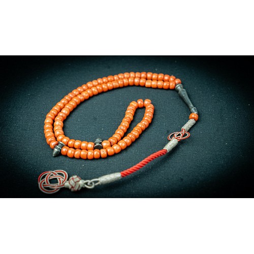 93 - A CORAL PRAYER BEADS, 18TH/19TH CENTURY, 
The tasbih strung with 99 flatted spherical coral beads, s... 