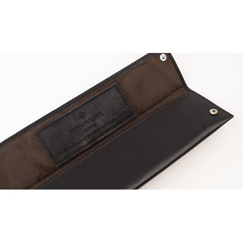 13 - A  PATEK PHILIPPE LEATHER WATCH CASE
Of rectangular form, lined with suede, crafted in dark brown le... 