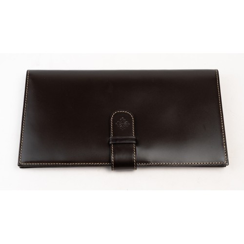 15 - BRAND-NEW DARK BROWN A PATEK PHILIPPE PASSPORT HOLDER, CENEVE
Of rectangular form, crafted in dark b... 