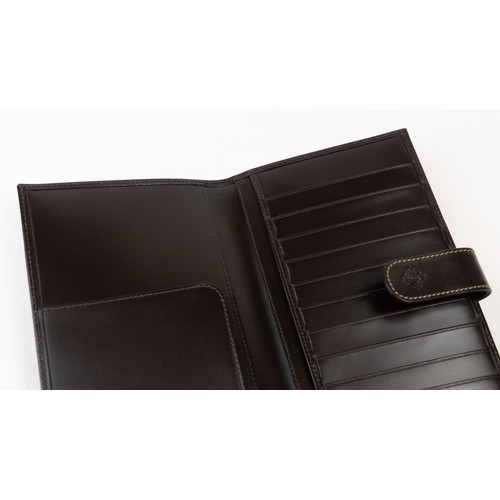 15 - BRAND-NEW DARK BROWN A PATEK PHILIPPE PASSPORT HOLDER, CENEVE
Of rectangular form, crafted in dark b... 