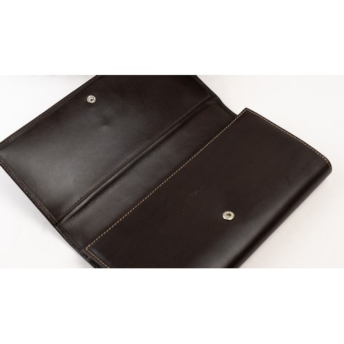 16 - BRAND-NEW DARK BROWN LEATHER PATEK PHILIPPE WALLET, GENEVE
Of rectangular form, crafted in dark brow... 