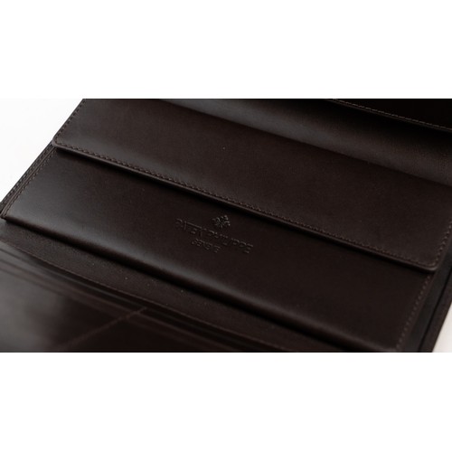 16 - BRAND-NEW DARK BROWN LEATHER PATEK PHILIPPE WALLET, GENEVE
Of rectangular form, crafted in dark brow... 