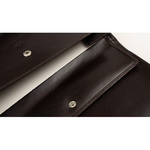 16 - BRAND-NEW DARK BROWN LEATHER PATEK PHILIPPE WALLET, GENEVE
Of rectangular form, crafted in dark brow... 