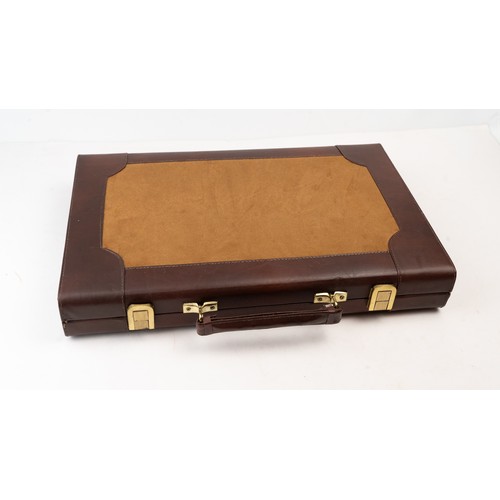 51 - A BRIEFCASE-STYLE BACKGAMMON PLAY,

 Of rectangular form, the suitcase crafted in brown suede with d... 