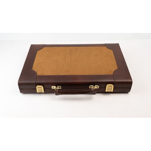 51 - A BRIEFCASE-STYLE BACKGAMMON PLAY,

 Of rectangular form, the suitcase crafted in brown suede with d... 