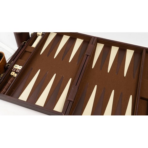 51 - A BRIEFCASE-STYLE BACKGAMMON PLAY,

 Of rectangular form, the suitcase crafted in brown suede with d... 