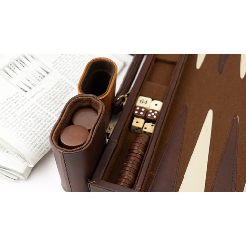 51 - A BRIEFCASE-STYLE BACKGAMMON PLAY,

 Of rectangular form, the suitcase crafted in brown suede with d... 