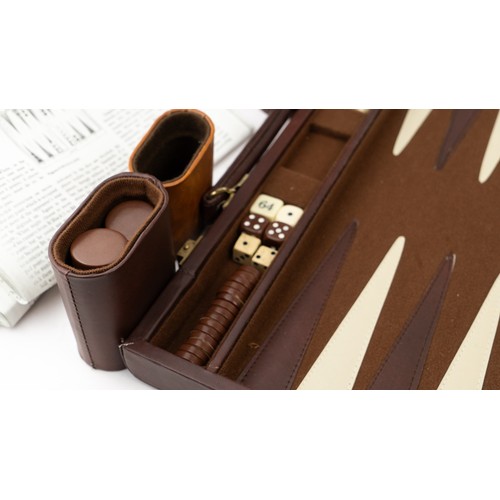 51 - A BRIEFCASE-STYLE BACKGAMMON PLAY,

 Of rectangular form, the suitcase crafted in brown suede with d... 