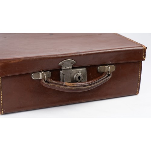 106 - A DARK BROWN LEATHER BRIEFCASE, EARLY 20th CENTURY 
Of rectangular form, a small briefcase featuring... 