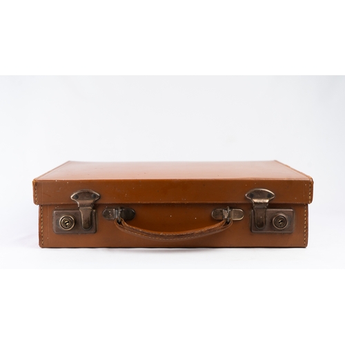 111 - A LEATHER BRIEFCASE, EARLY 20TH CENTURY
Of rectangular form, a briefcase featuring a leather exterio... 