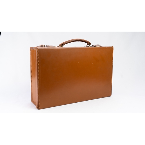 111 - A LEATHER BRIEFCASE, EARLY 20TH CENTURY
Of rectangular form, a briefcase featuring a leather exterio... 