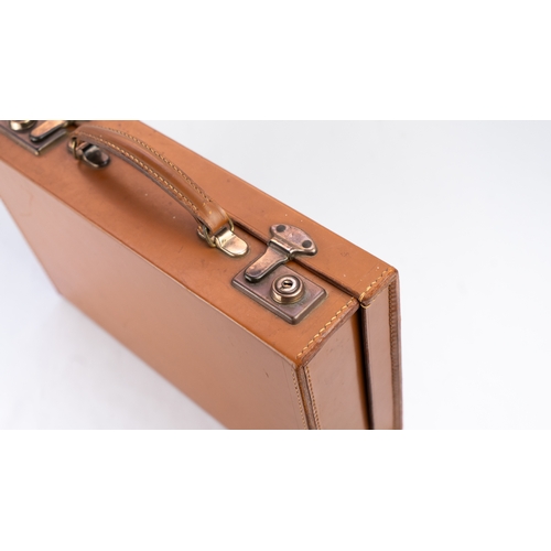 111 - A LEATHER BRIEFCASE, EARLY 20TH CENTURY
Of rectangular form, a briefcase featuring a leather exterio... 