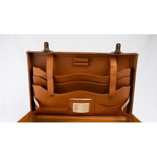 111 - A LEATHER BRIEFCASE, EARLY 20TH CENTURY
Of rectangular form, a briefcase featuring a leather exterio... 