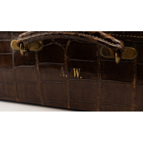 113 - A FINE LEATHER CROCODILE-EMBOSSED TRAVEL CASE, EARLY 20TH CENTURY
Of rectangular form, crafted in ri... 