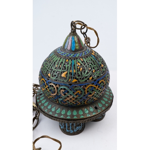 25 - AN ENAMELLED  BRONZE LAMP, ANDALUSIA, LATE 19TH CENTURY
Of globular form, standing on four cylindric... 