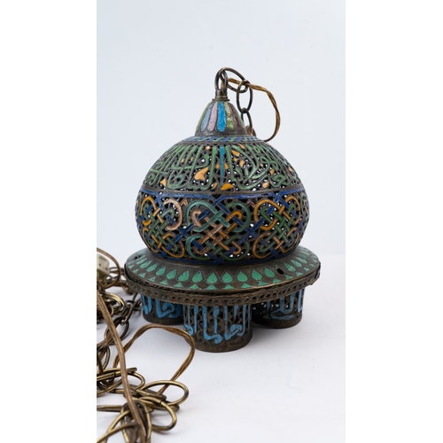 25 - AN ENAMELLED  BRONZE LAMP, ANDALUSIA, LATE 19TH CENTURY
Of globular form, standing on four cylindric... 