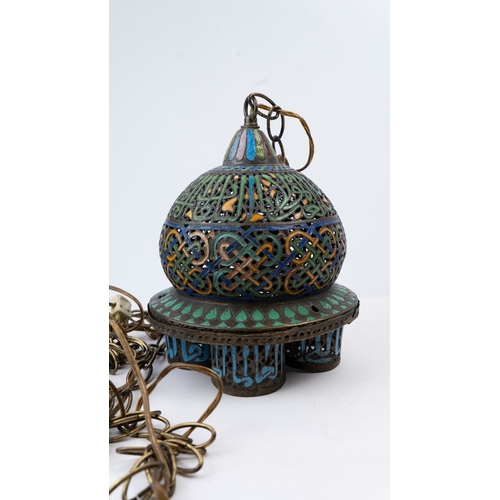 25 - AN ENAMELLED  BRONZE LAMP, ANDALUSIA, LATE 19TH CENTURY
Of globular form, standing on four cylindric... 