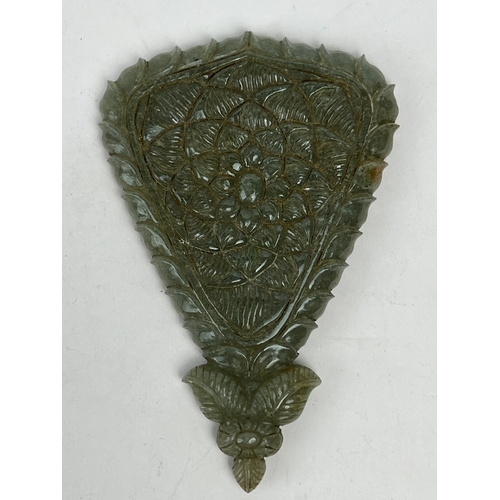 32 - A BEAUTIFUL GEM INSET JADE MIRROR, INDIA
Of inverted triangle form, inlaid with rubies and emeralds ... 