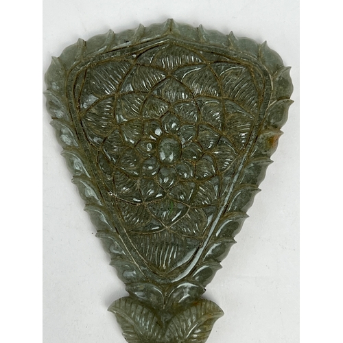 32 - A BEAUTIFUL GEM INSET JADE MIRROR, INDIA
Of inverted triangle form, inlaid with rubies and emeralds ... 