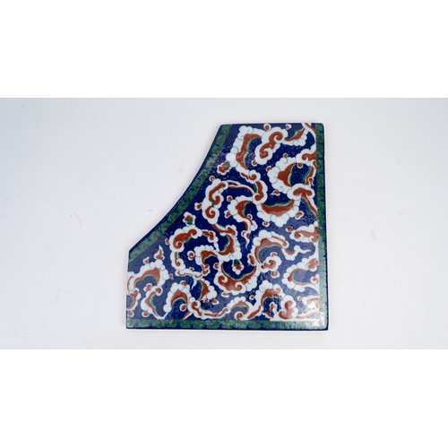 41 - A LARGE IZNIK STYLE POLYCHROME POTTERY CORNER TILE, SPANDREL, 
The cobalt blue ground decorated unde... 