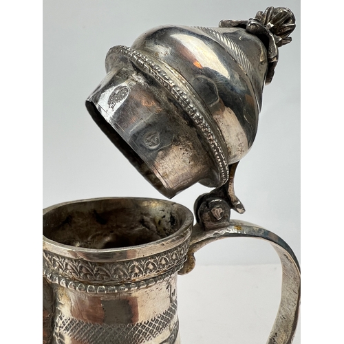 51 - A SILVER COFFEE POT, DALLAH, OTTOMAN, 20th CENTURY 
Of traditional form, raised on a flat base, feat... 