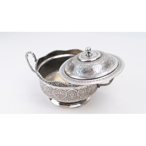 69 - PERSIAN SILVER SUGAR BOWL ISFAHAN, CIRCA 1930 PAHLAVI PERIOD
The  scalloped rim on four cast foliate... 